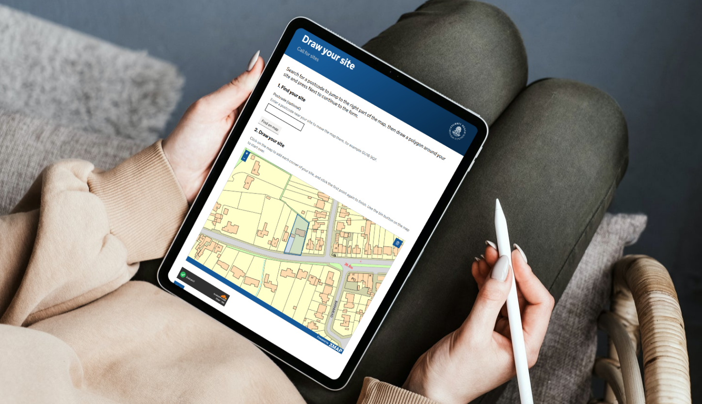 call for sites public map viewed on a tablet. the lady is holding a stylus ready to draw on the map, which gives her 10 extra GIS nerd points for drawing accuracy